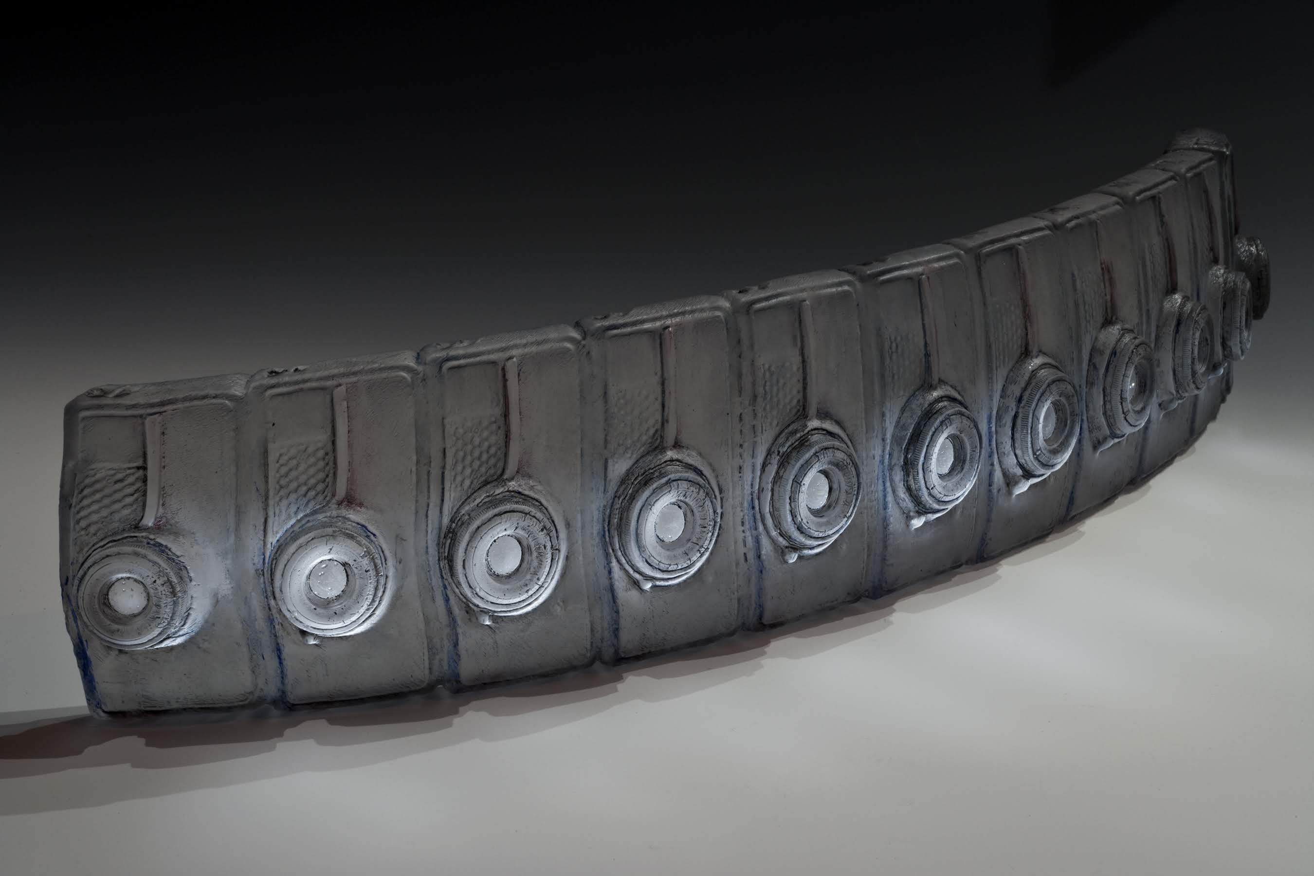 Title: Time band Materials: Glass, Paint Technique: Cast glass, slumped, sandblasted, polished, painted Size: 28"L x 6"W x 8"H Date: 2016 Photo: Douglass Sandburg