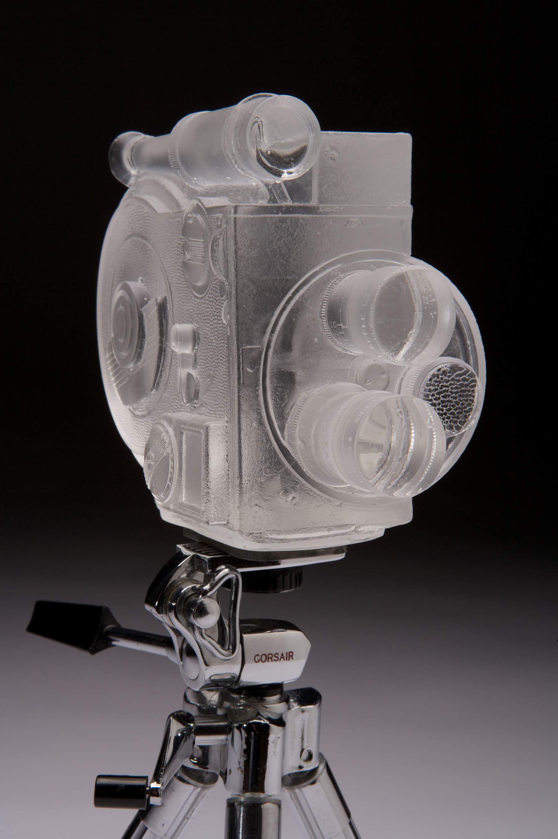 TITLE: Revere 8mm DATE: 2012 SIZE: 6.5”L x 2.25”W x 6””H MEDIUM: Glass, tripod TECHNIQUE: Lost wax casting, acid-etched, polished PHOTO: Azad Photo
