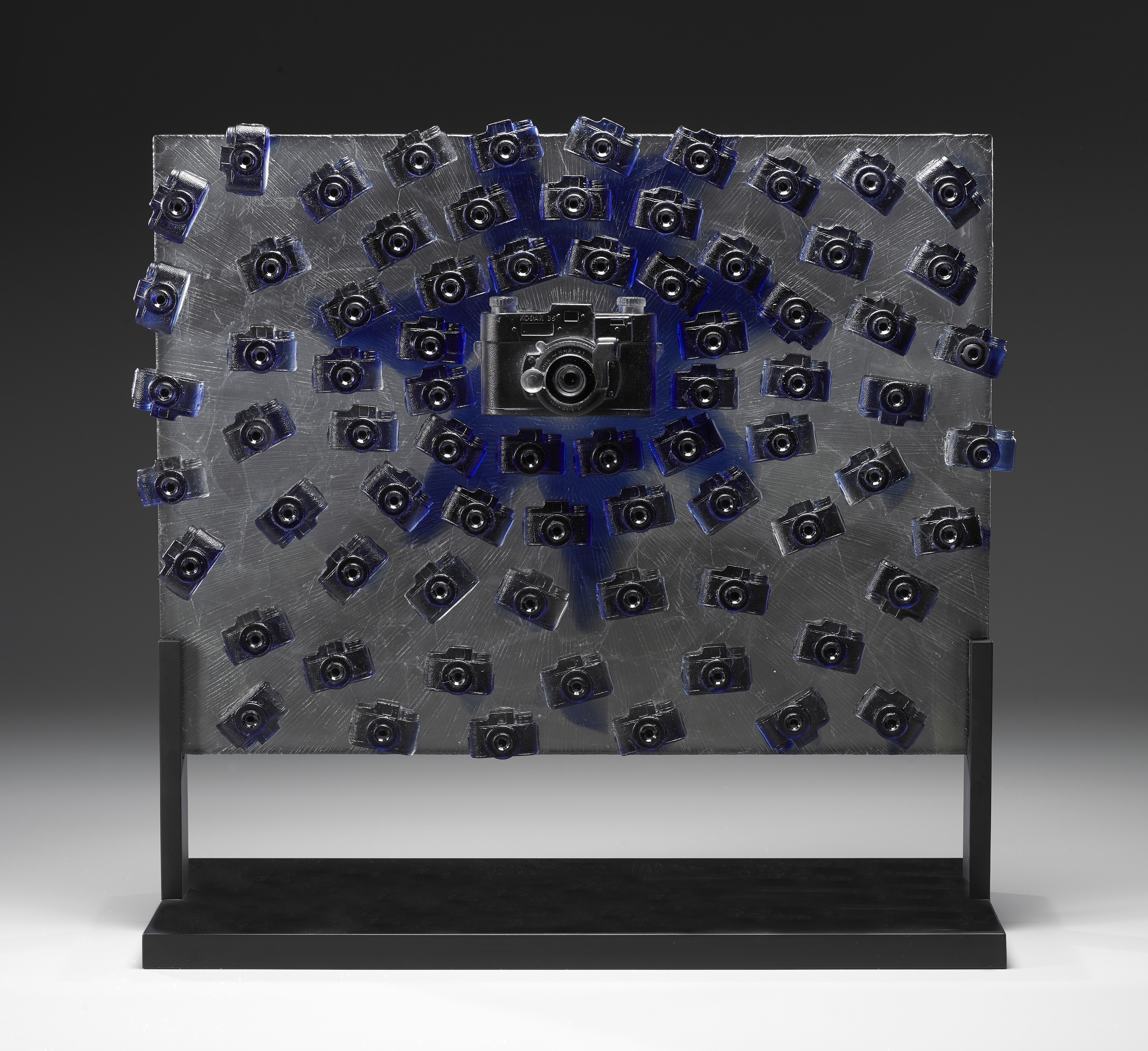 Title: "Propagation of Light" Method: Cast glass, coldworked Material: glass metal Size: 24"L x 12" W x 25"H Date: 2018 Photo: Josh Hershman